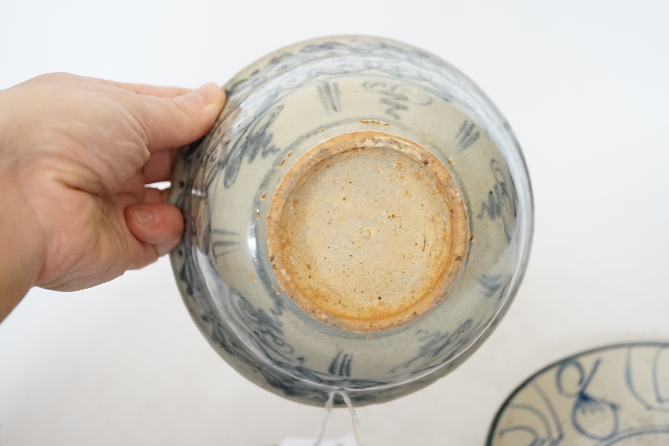 A Chinese Ming blue and white bowl and two Qing dynasty dishes, largest 17cm diameter